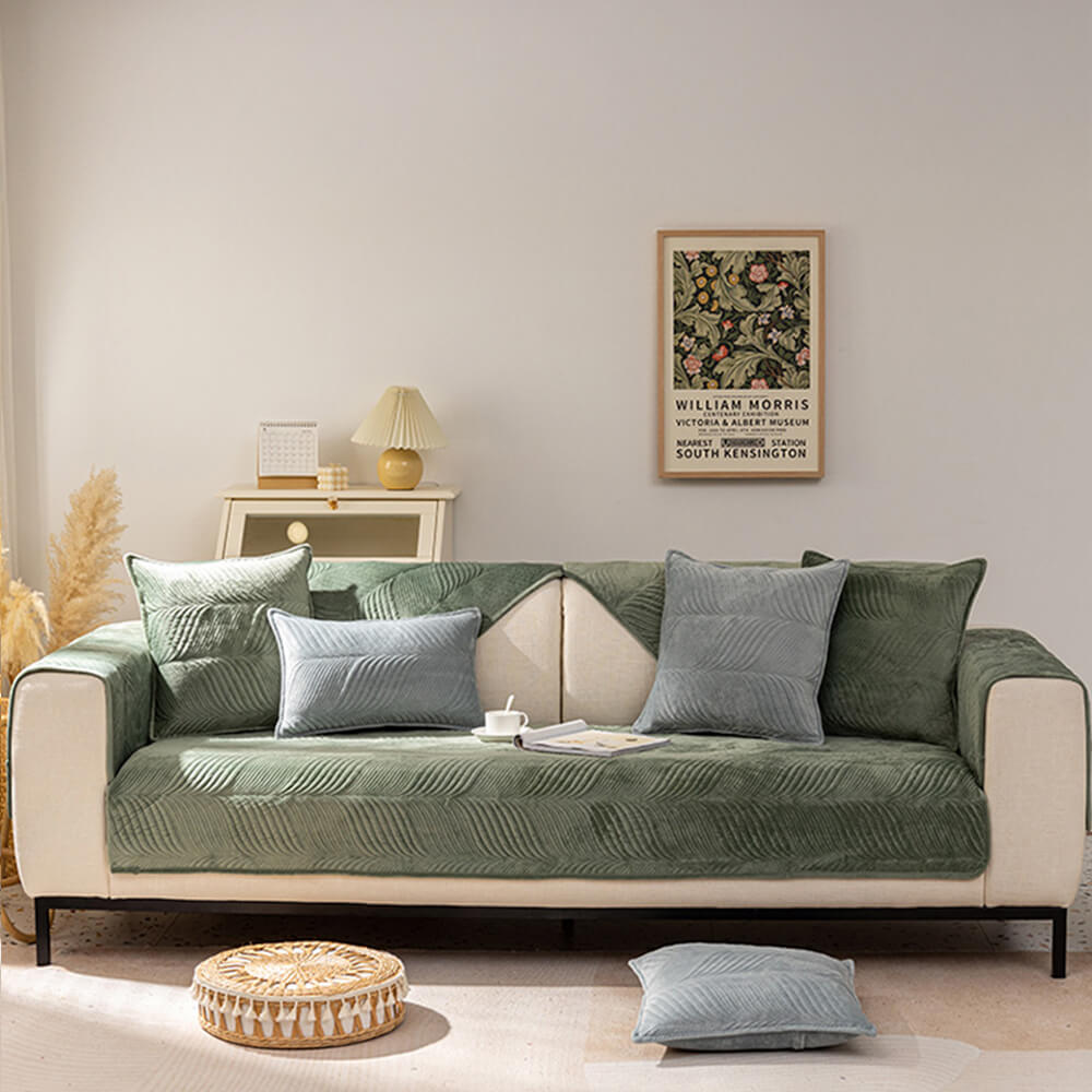 Stylish plush leaf pattern non-slip sofa cover, great for refreshing home decor and protecting furniture.