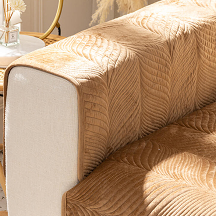 Warm plush non-slip couch cover with a stylish leaf pattern, easy to clean and maintain.