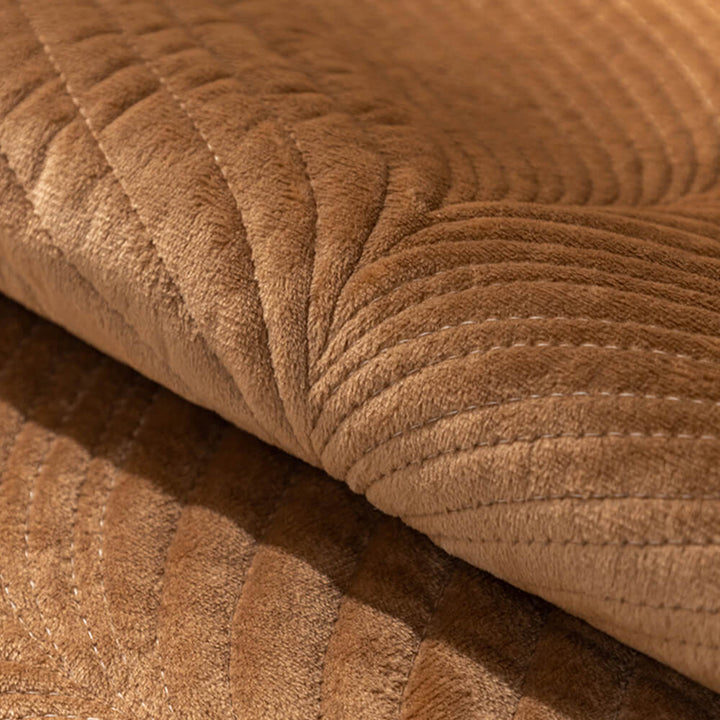Furniture protector: plush leaf pattern sofa cover, ensuring a secure, non-slip fit.