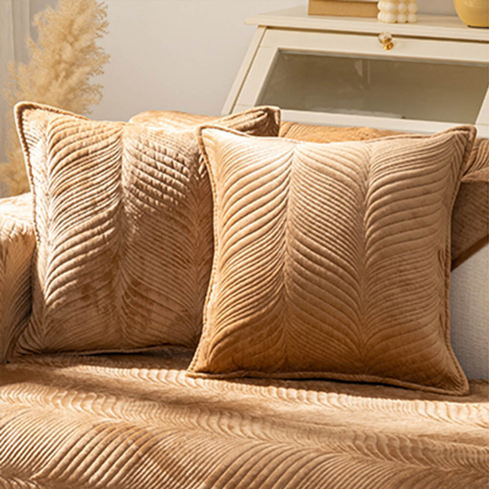 Living room with a sofa adorned by a plush non-slip leaf pattern cover, chic home decor.