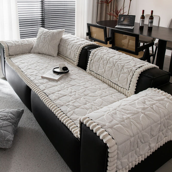 Non-slip leaf pattern sofa cover in plush fabric, protects against pets & general wear