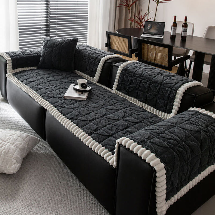 Machine washable plush sofa cover featuring an elegant leaf pattern, non-slip base