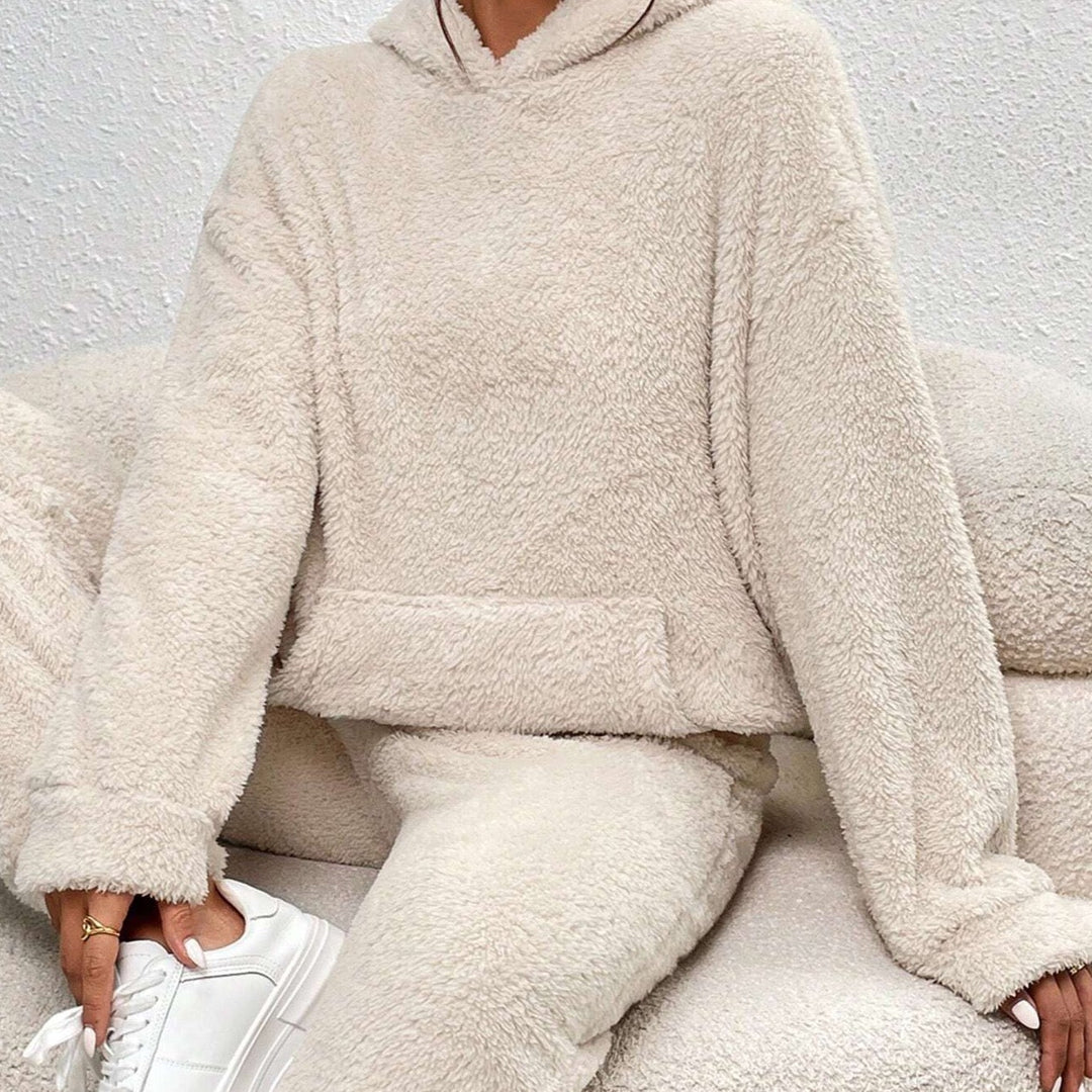 Cozy women's plush loungewear, matching top & pants, perfect for ultimate comfort & leisure.