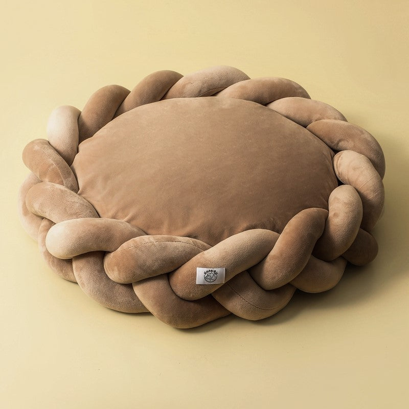 All breeds love this comfortable, machine washable plush dog bed with braided edges.