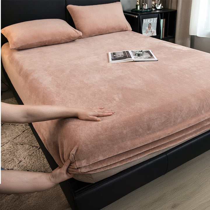 Milk velvet fitted sheet stretching smoothly over a mattress, providing excellent coverage.