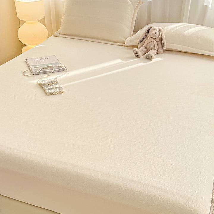 Packaged milk velvet fitted sheet and pillowcases, ready to transform your bed into a cozy haven.