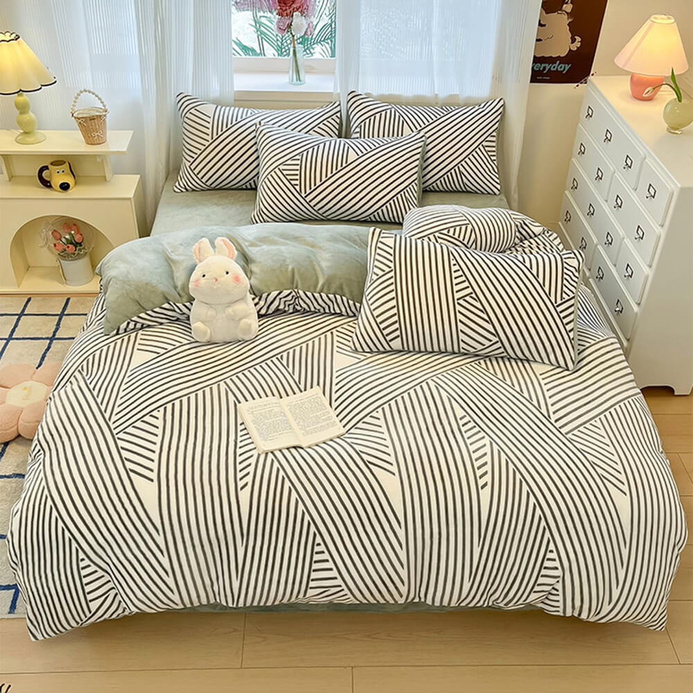 Soft milk velvet bedding set for winter, including a quilt cover, fitted sheet, and pillowcases