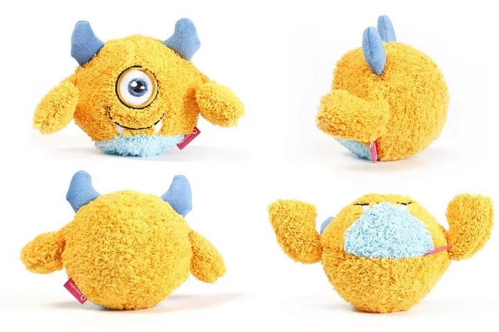 Squeaky plush monster ball, a durable interactive dog toy for energetic canine entertainment