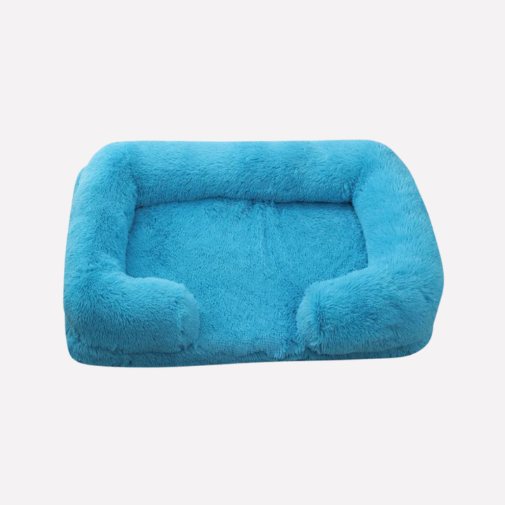 Content cat napping in a cozy plush non-slip cat bed, pet supplies