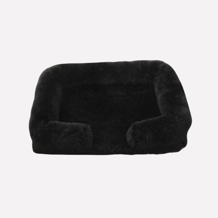 Gray plush pet bed with non-slip bottom, a cozy haven for pets