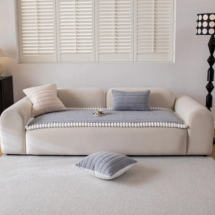 Kid-friendly non-slip furniture protector in a vibrant multi-color design, easy to clean.