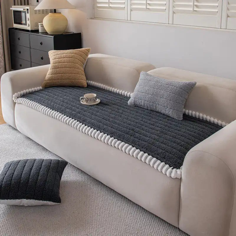 Pet-friendly non-slip furniture protector in a light brown hue, securing a loveseat.