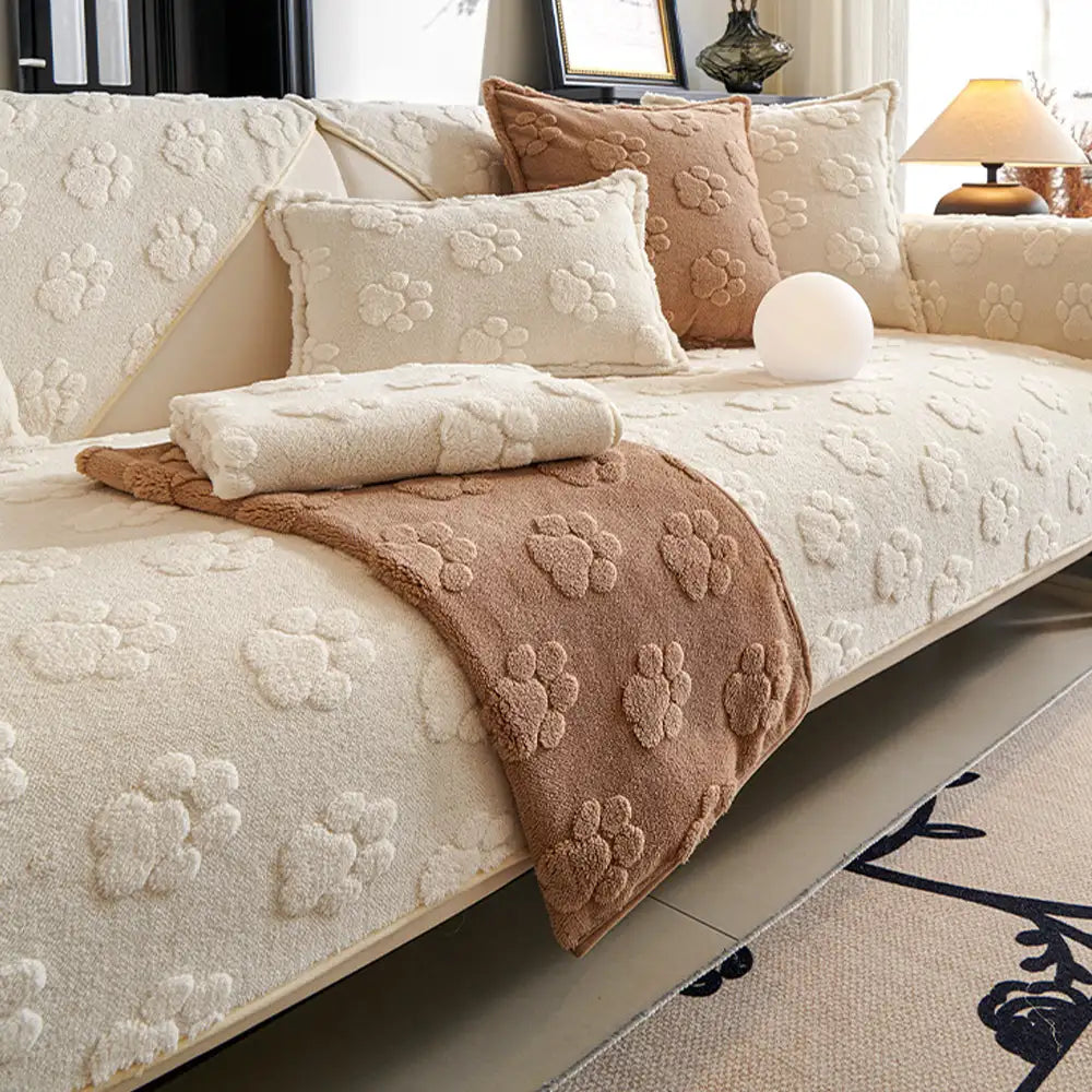 Machine washable plush sofa cover with distinct paw prints, ideal for pet owners