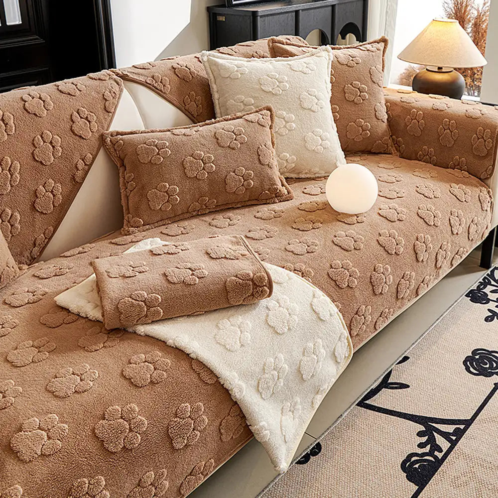 Living room sofa cover, pet-friendly and non-slip, adorned with paw print motifs