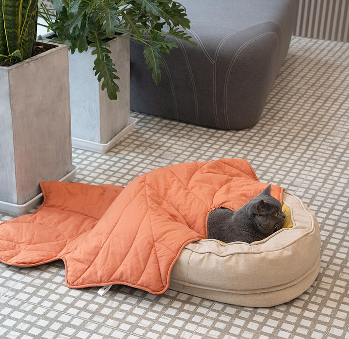 Soft fluffy orthopedic pet bed, donut design, promoting better sleep and joint health.