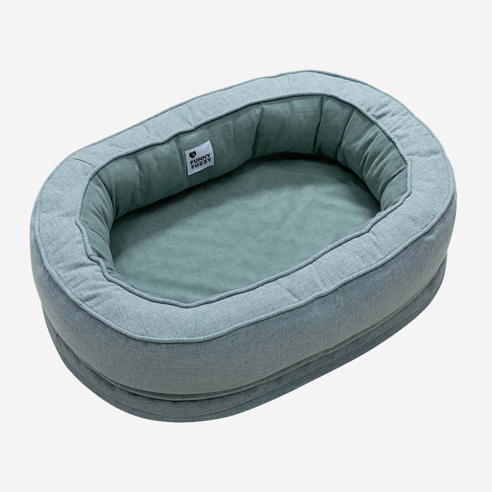 Hypoallergenic fluffy orthopedic dog bed, donut style, ideal for sensitive pets.