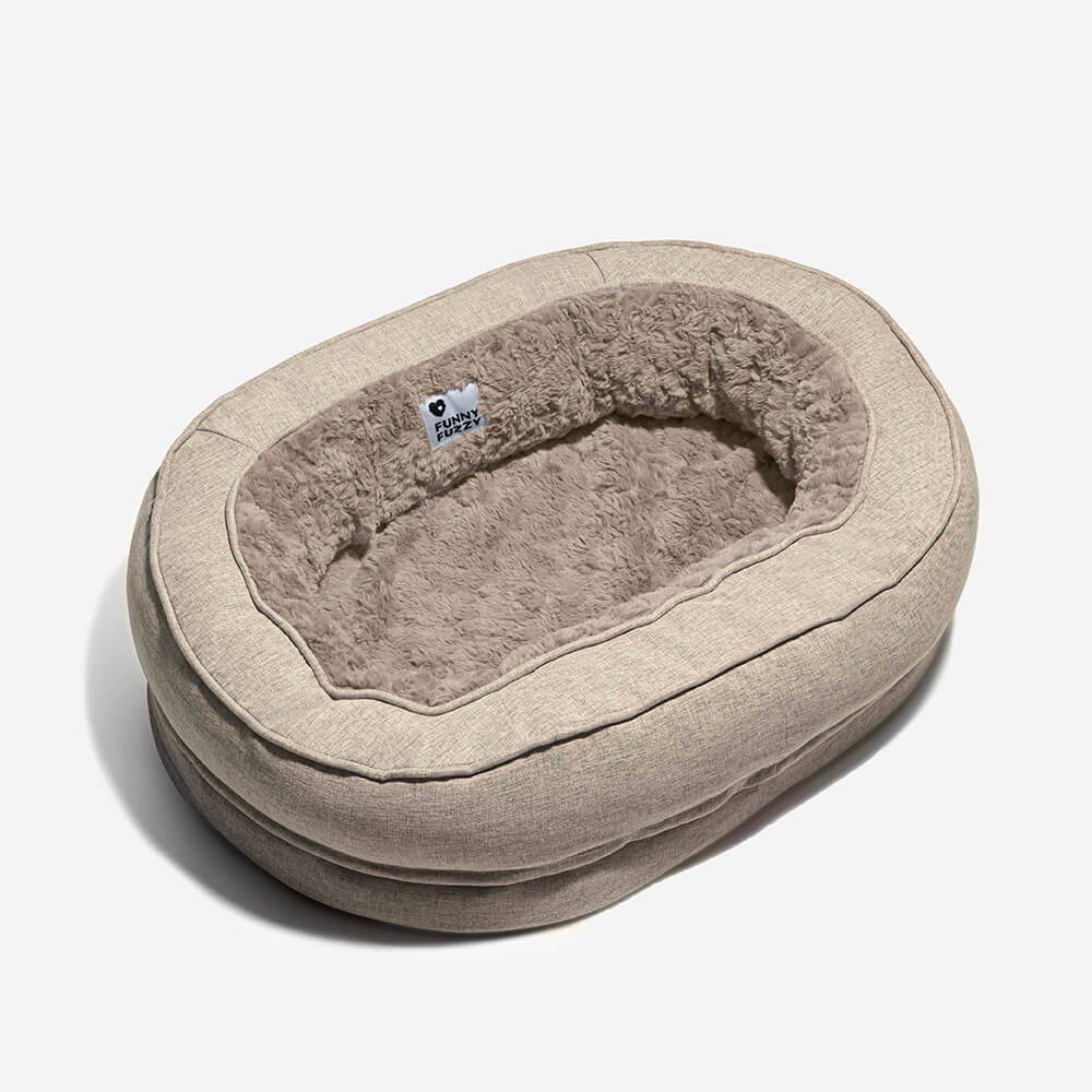 Deep-cushioned fluffy orthopedic dog bed, donut design, for superior pressure relief.