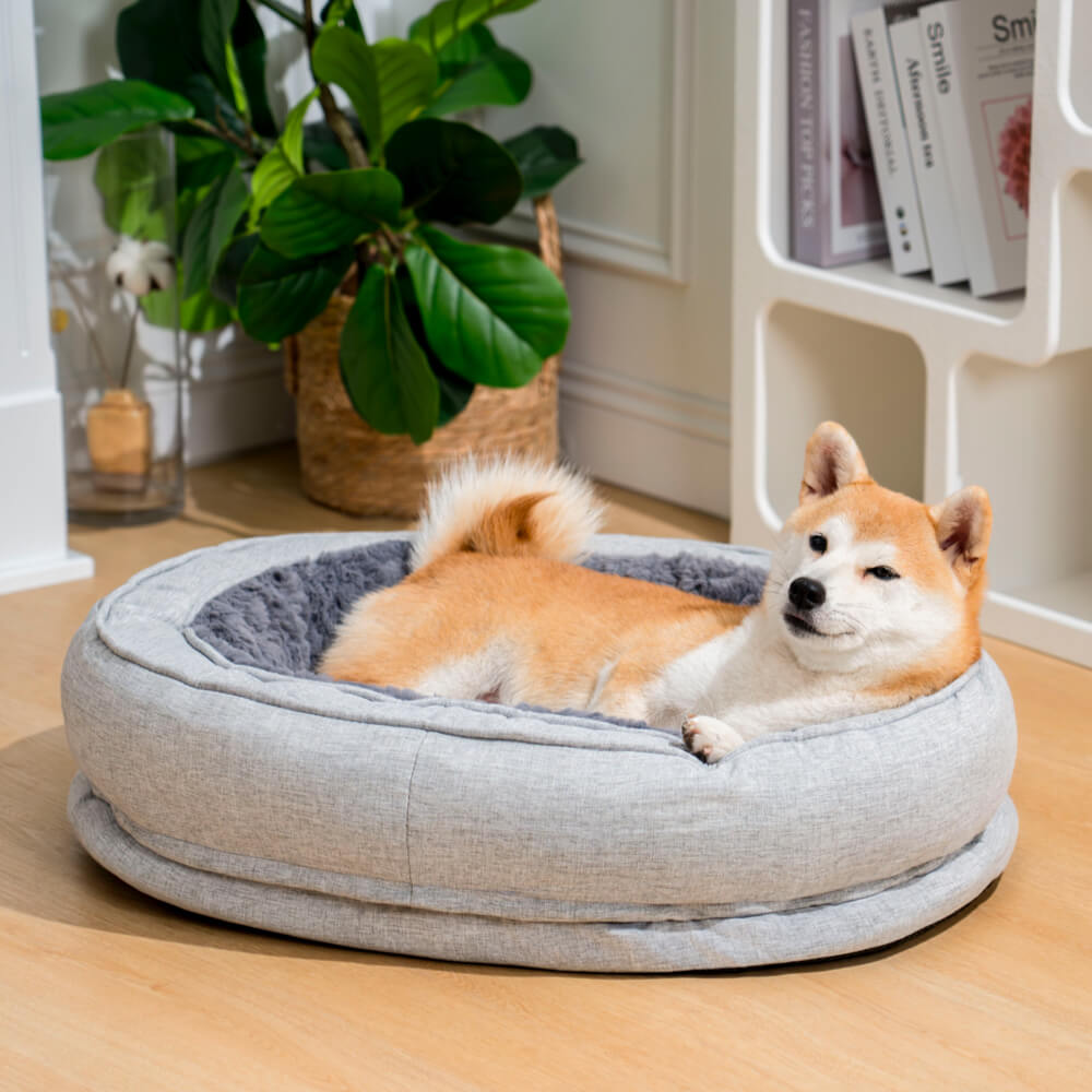Comfort-focused fluffy orthopedic dog bed, donut design, for restful pet sleep.