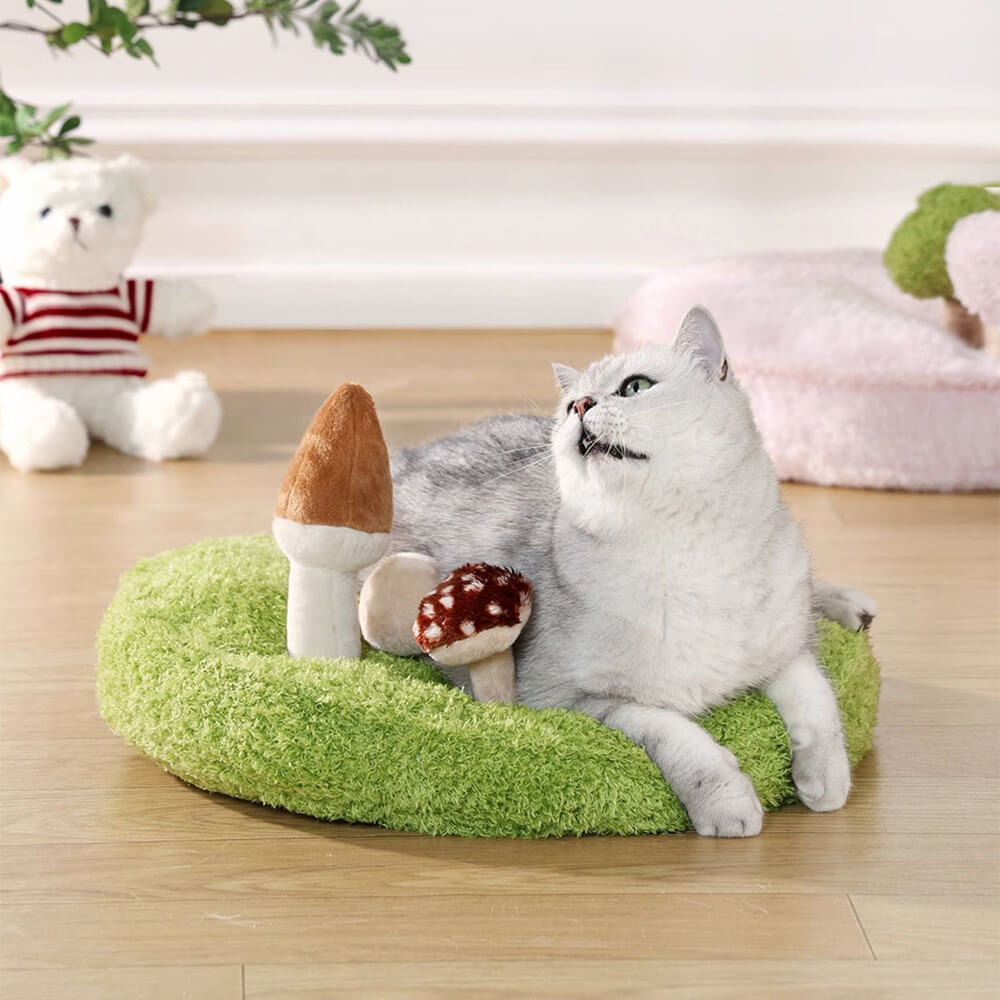 Pet nature play bed in a plush, durable fabric with three removable, interactive toys for small pets.