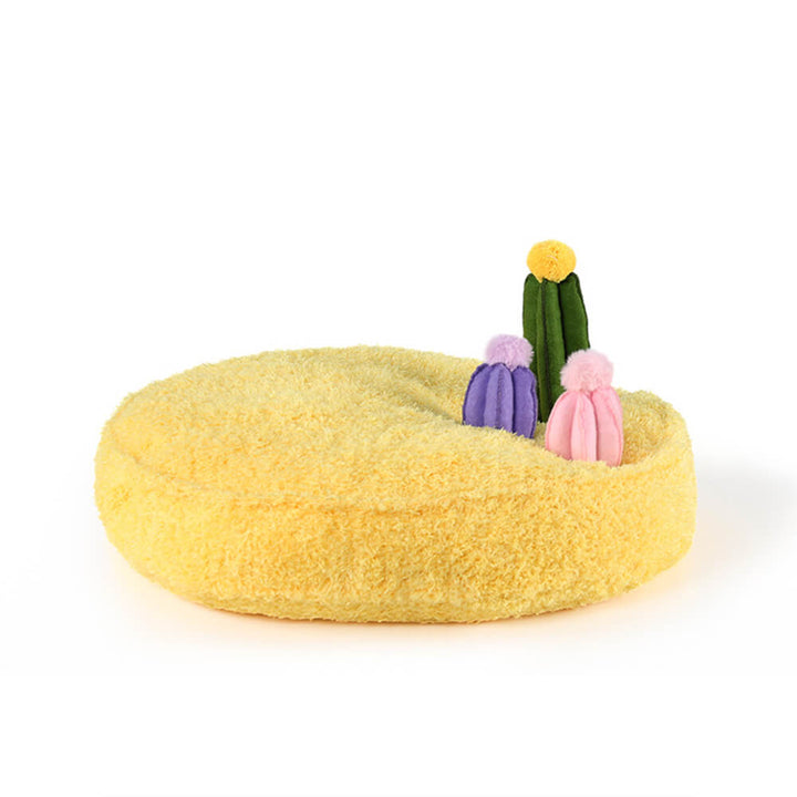 Nature-themed plush pet bed with removable leaf, mushroom, and bird toys for active play.