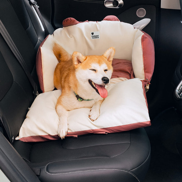 Comfy pet travel dog bed with charming bear ears, enhancing car safety for small dogs.