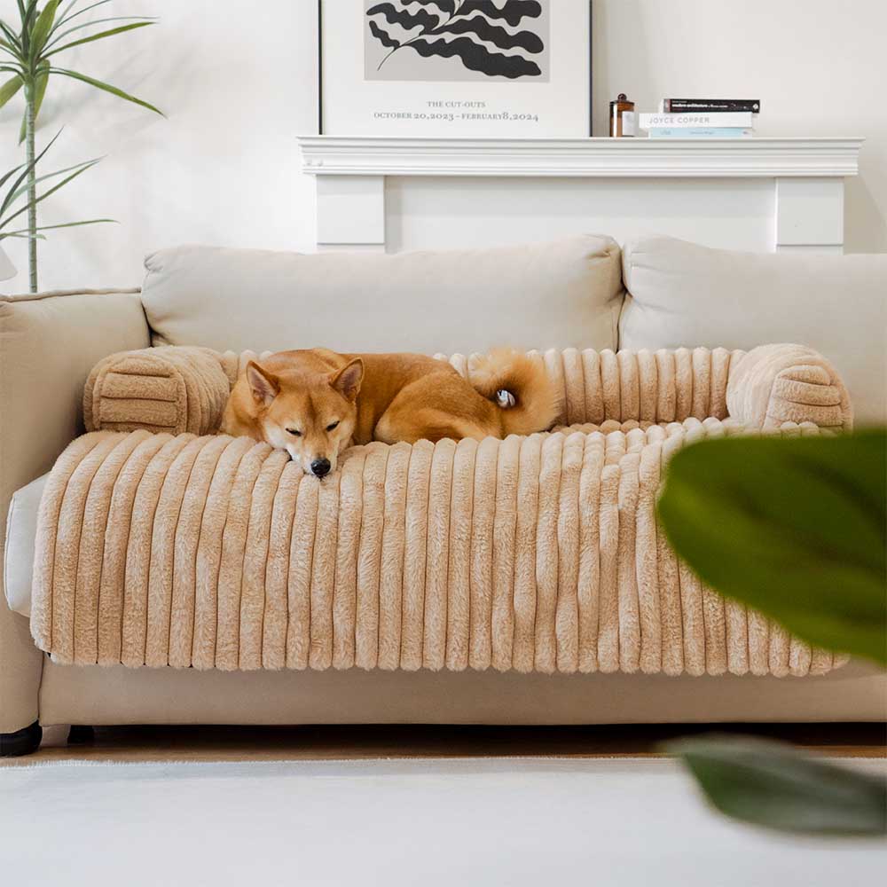 Gray plush couch cover for pets with a built-in bolster, offering comfort and sofa protection, non-slip base.