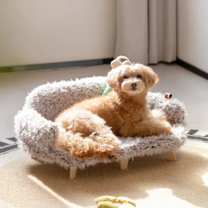 Plush pet sofa for dogs & cats with wooden feet, offering soft comfort & stylish home decor.