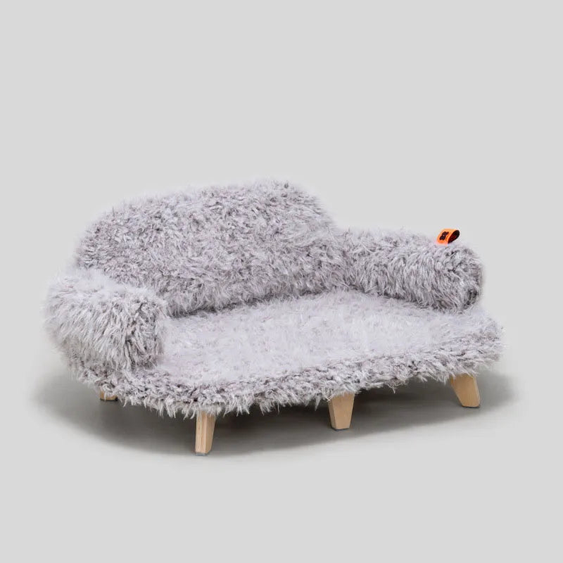 Unisex pet sofa, a cozy dog & cat bed with soft plush and elegant wooden feet for ultimate pet comfort.