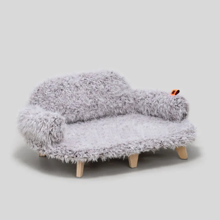 Unisex pet sofa, a cozy dog & cat bed with soft plush and elegant wooden feet for ultimate pet comfort.