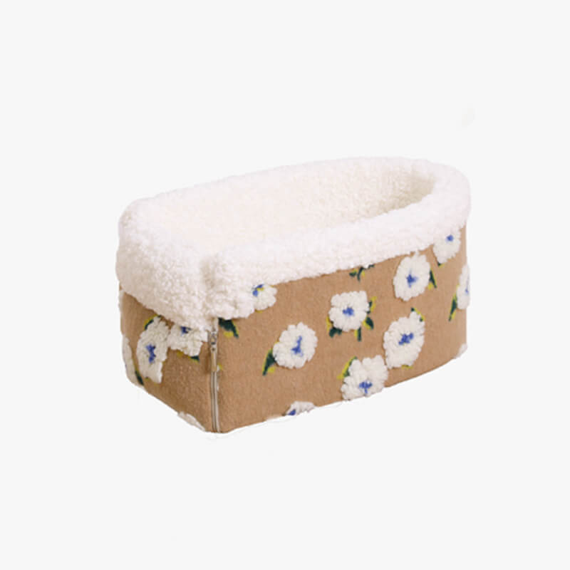 Close-up of fluffy wool fleece texture on a dog car console safety seat with a flower accent.