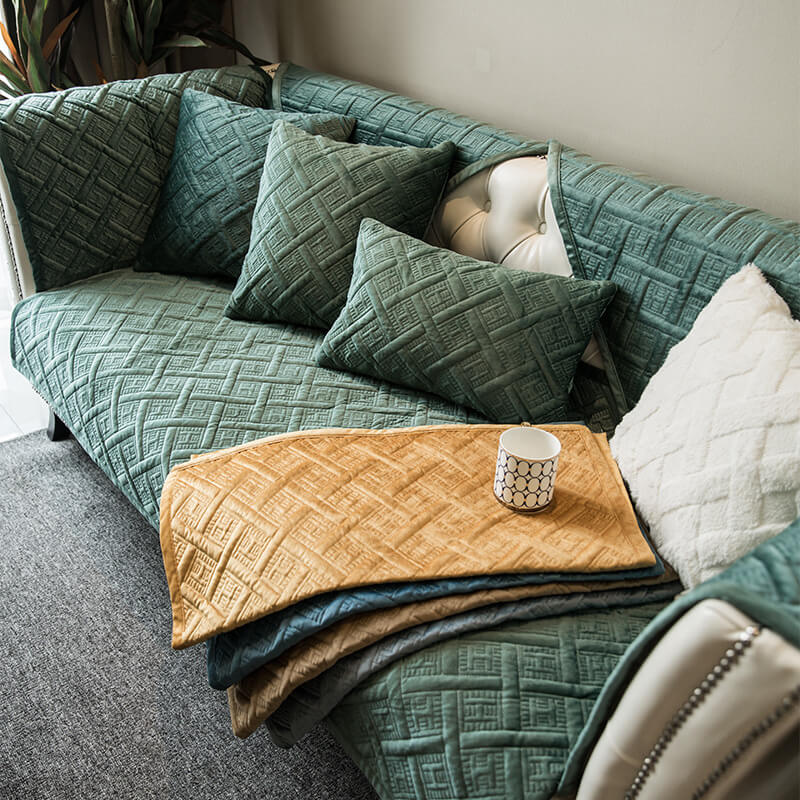 Plush quilted velvet sofa cover in a neutral hue, perfect for ultimate comfort and living room protection