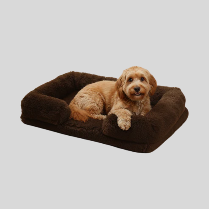 Cozy cat bed, rectangular shape with plush material, ideal for a calming pet rest. Washable.