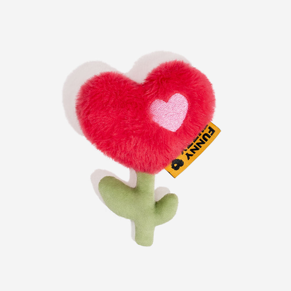 Soft pink rose plush squeaky toy for dogs, an engaging valentine pet gift for play time.