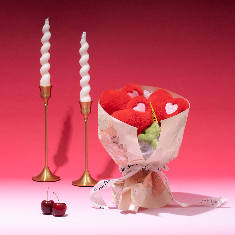 Close-up of a Pet Rose Plush Squeaky Love Toy, ideal for stimulating dog play.