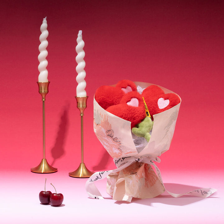Close-up of a Pet Rose Plush Squeaky Love Toy, ideal for stimulating dog play.