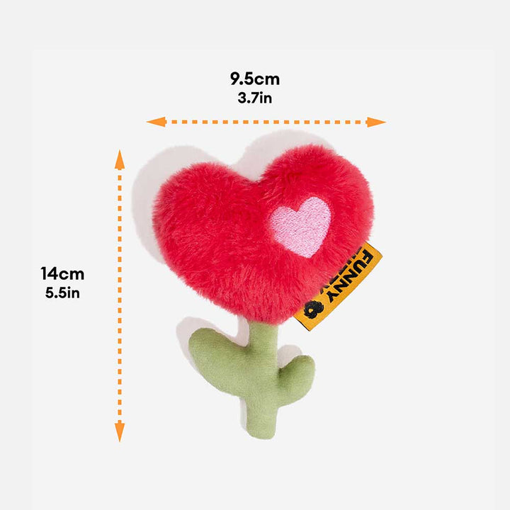 Durable Pet Rose Plush Squeaky Love Toy in dog's mouth, great for chewing and interactive play.