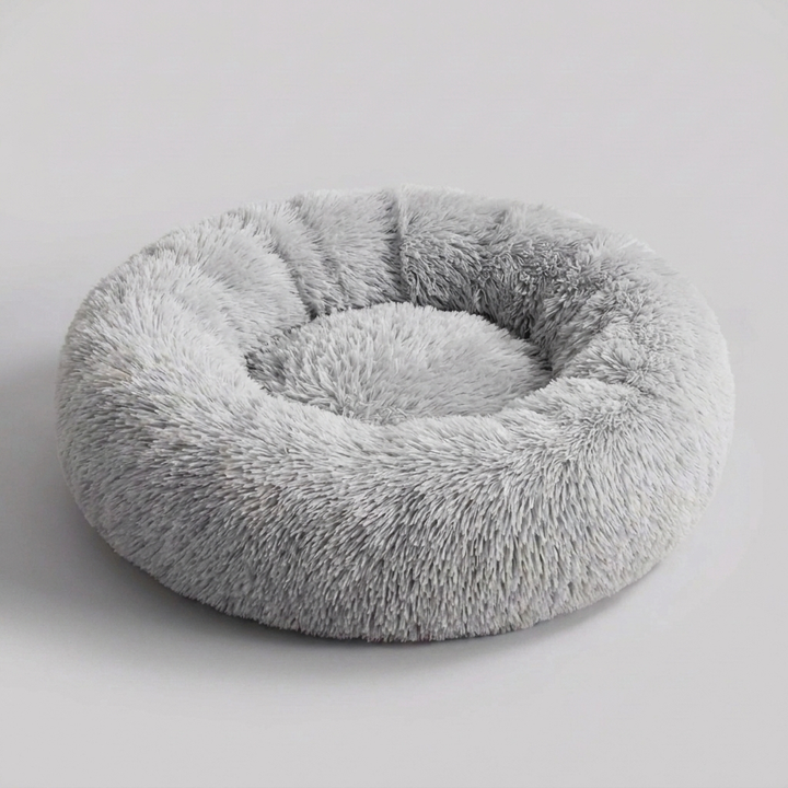 Soft faux fur texture of a washable calming dog bed, designed for ultimate comfort & anxiety relief in pets.