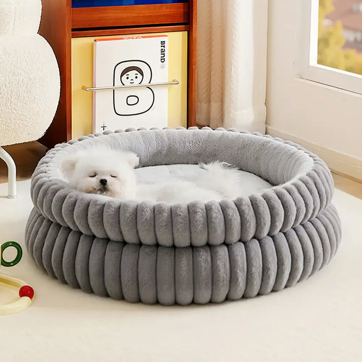 Soft round dog bed, dark grey, plush fabric, raised sides for head and neck support