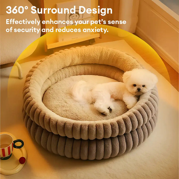 Warm round pet bed, beige, with a deep sleeping area and supportive raised edges for security