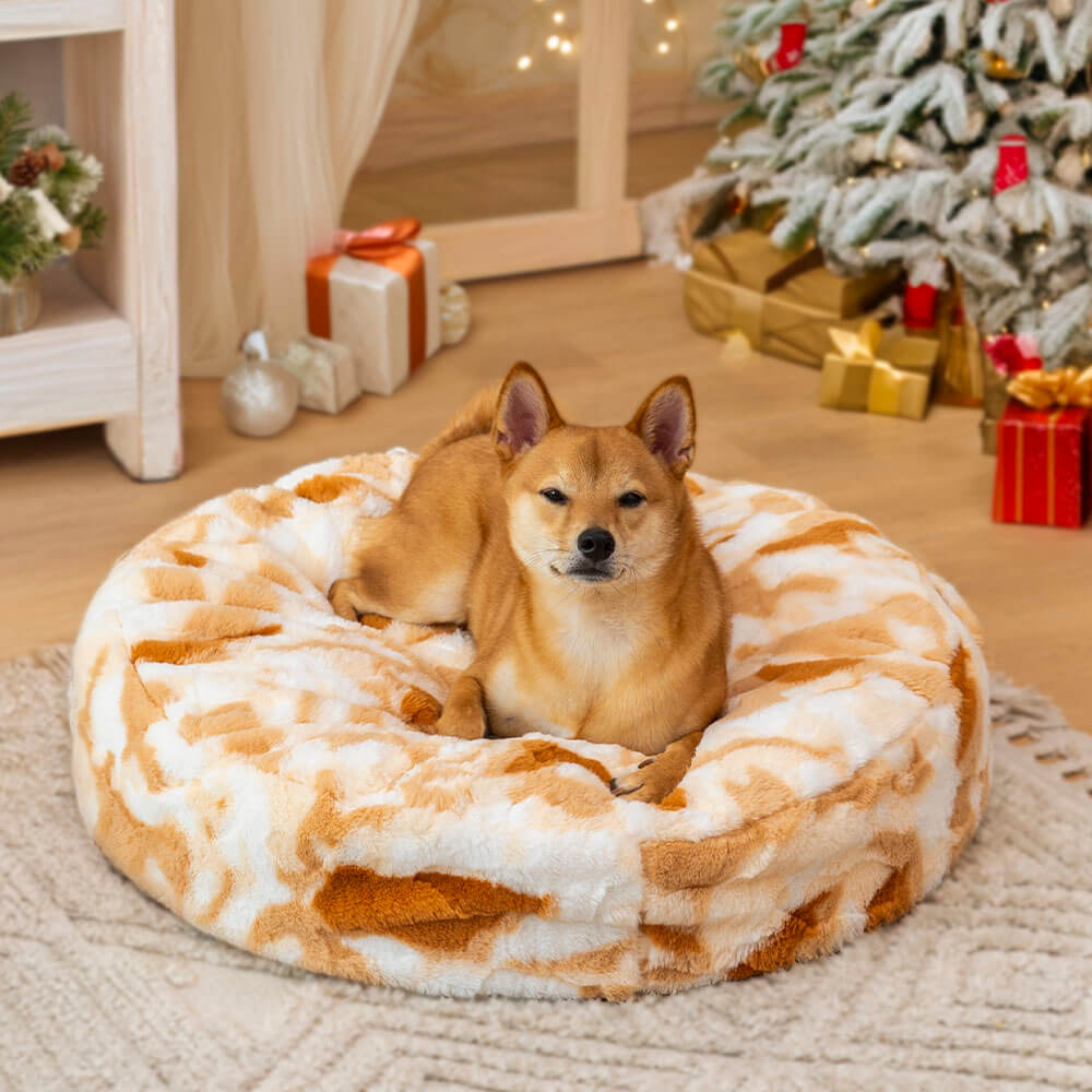 Unisex calming dog bed, round and plush, perfect for small to medium pets.