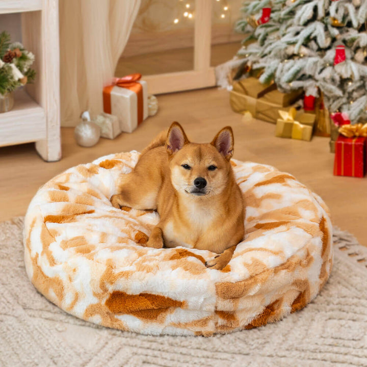 Unisex calming dog bed, round and plush, perfect for small to medium pets.