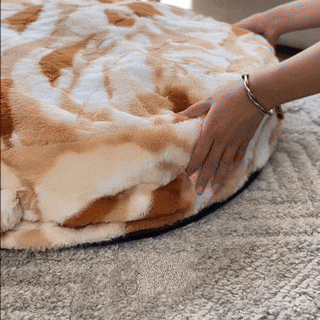 Durable round dog bed, washable and fluffy, promoting better sleep for pets.