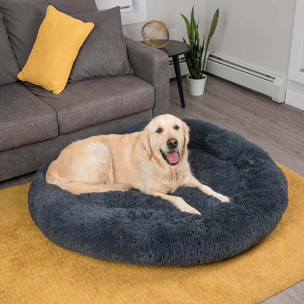 Plush round dog bed in grey, designed for pet comfort and anxiety relief