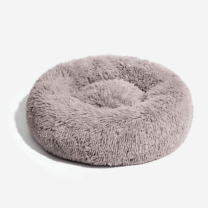 Comfortable pet bed, round shape, featuring soft fuzzy plush material