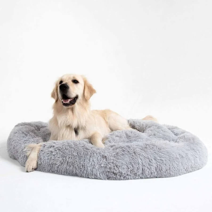 Soft fuzzy dog bed, round shape, providing soothing comfort for pets