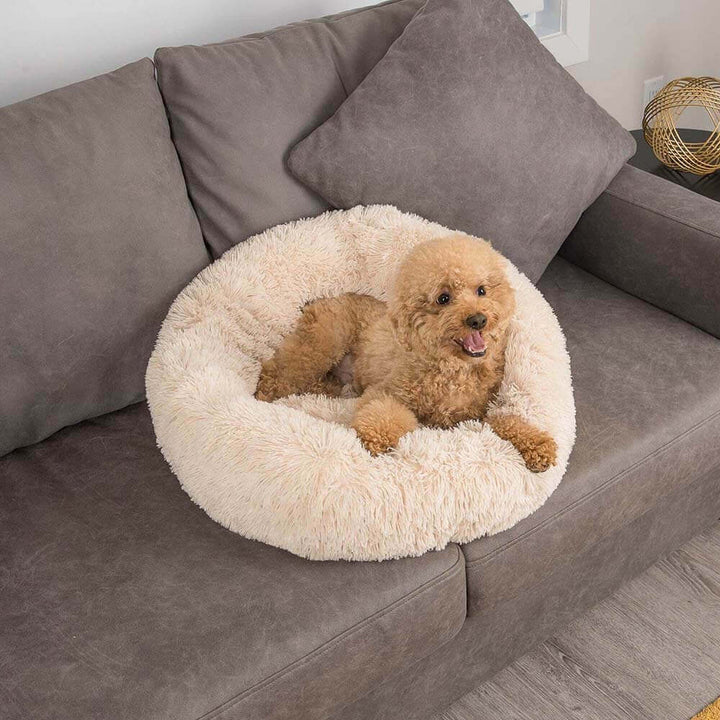 Grey round pet bed, fuzzy texture for ultimate dog comfort and soothing