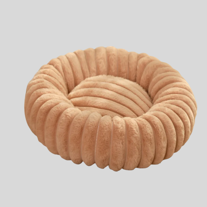 Plush round dog bed with removable gray cover, perfect for small to medium pets.