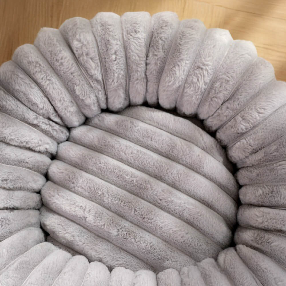 Close-up of a washable plush donut pet bed, showing its soft, calming texture.