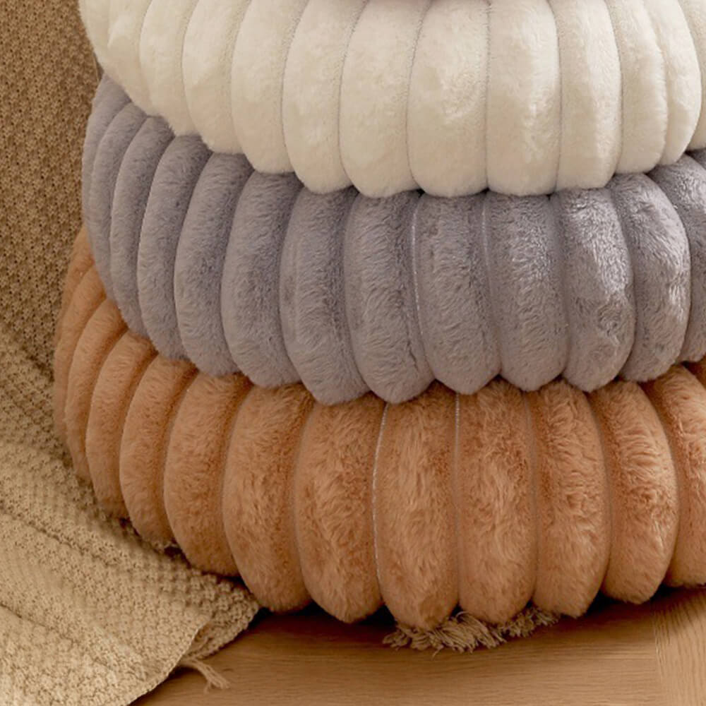Washable plush round pet bed, highlighting its comfort and easy-care features.
