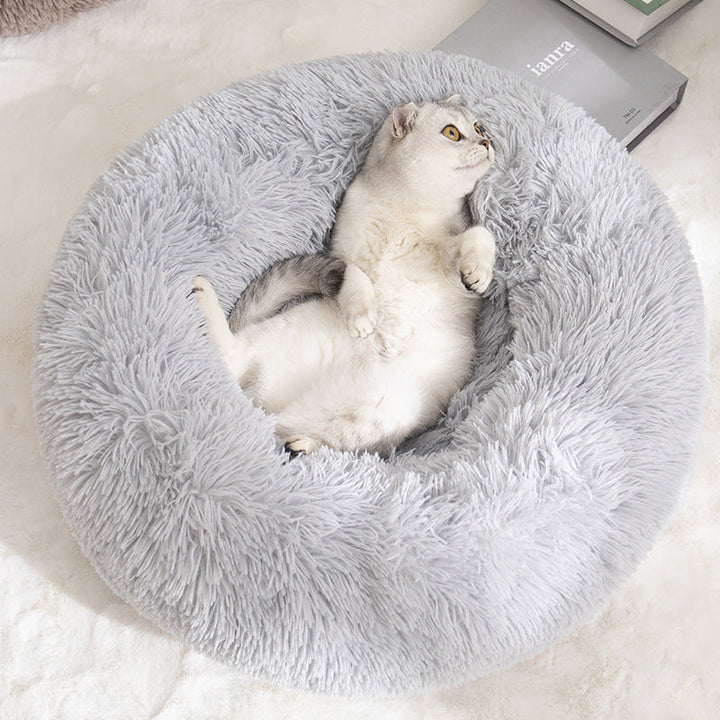 Plush round grey cat bed with raised edges for small pets, washable and comforting